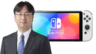 Nintendo president Shuntaro Furukawa in front of a Switch OLED